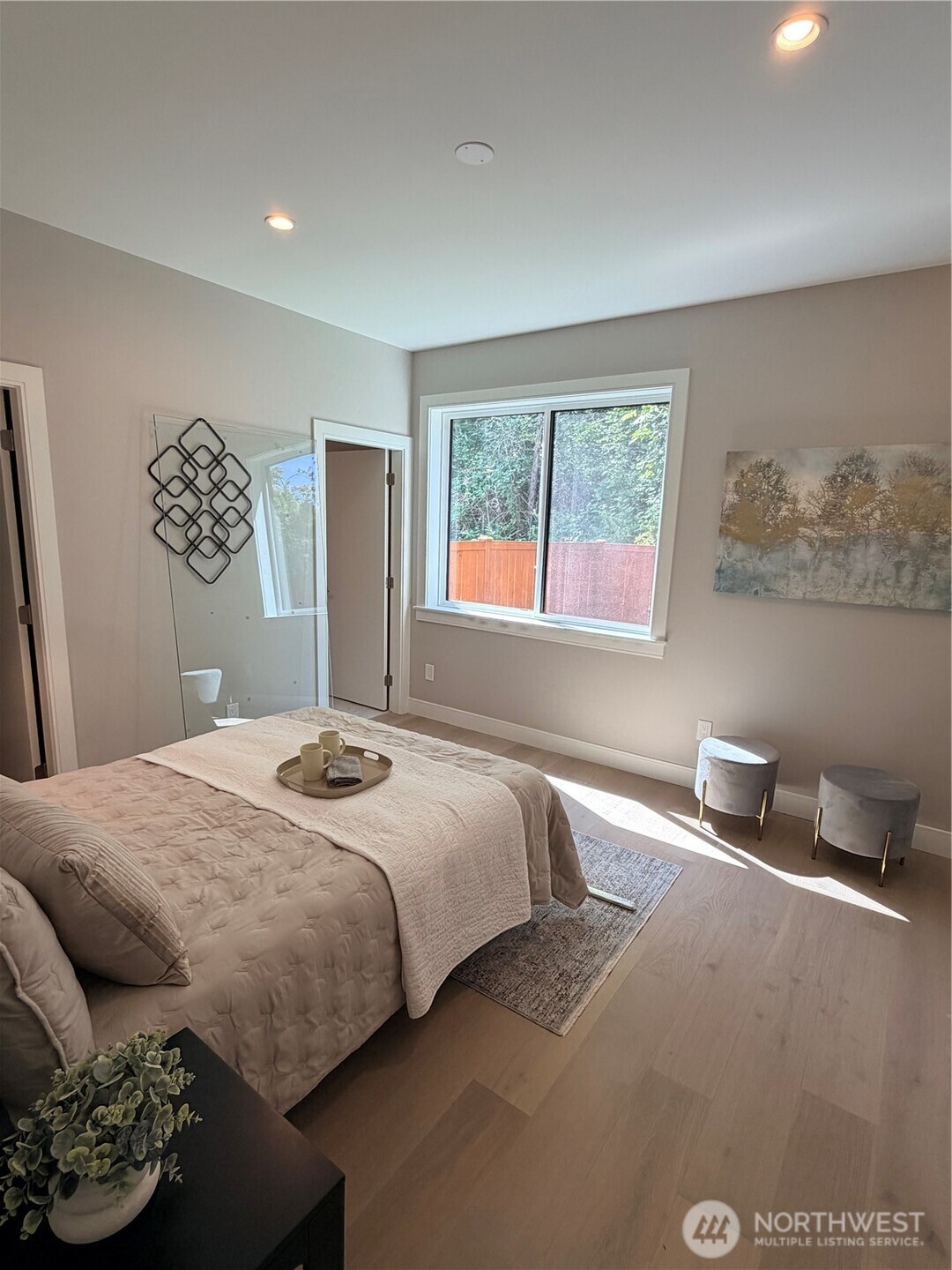 4305 Northeast 26th Court Renton, WA 98059 - Photo 15 of 40 a bedroom with a bed and a window