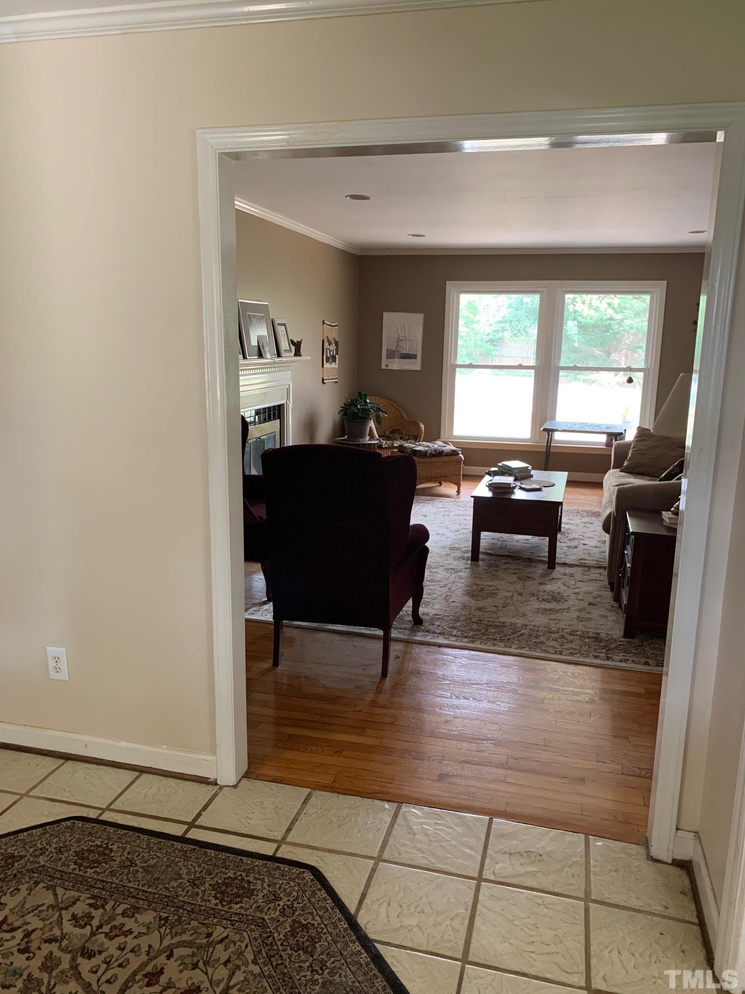 905 Queensferry Road Cary, NC 27511 - Photo 3 of 10 a living room with furniture a window and a table