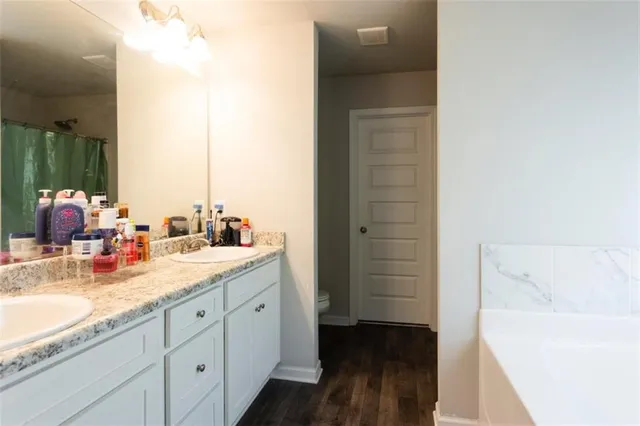 a en suite bathroom with a sink and a tub