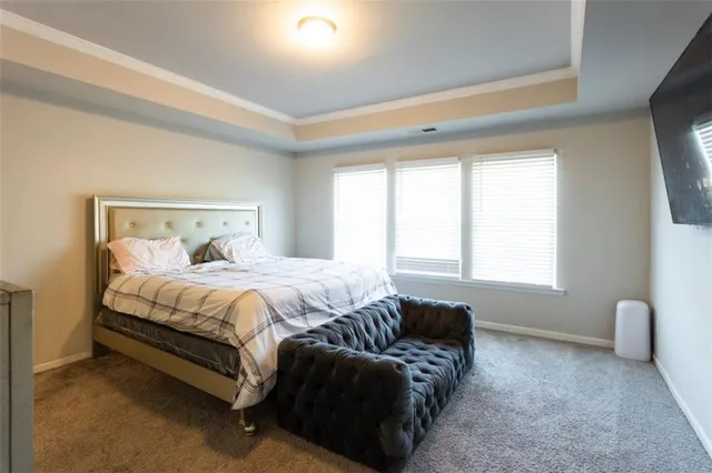 a bedroom with a bed and furniture