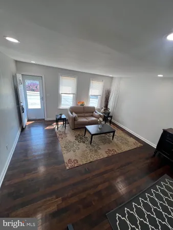 a view of a living room and hardwood floor