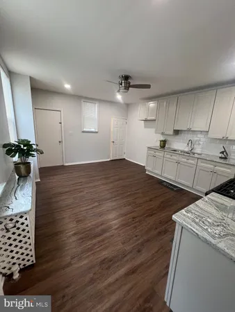 a view of a kitchen with wooden floor