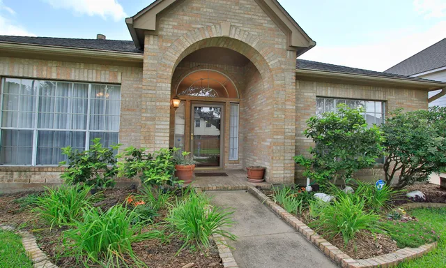 a house view with a garden space