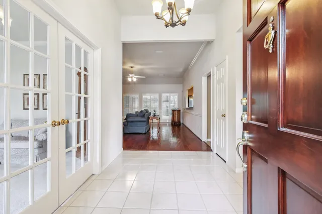a view of a hallway with seating area