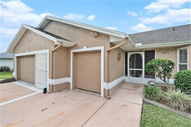 a view of front door and yard