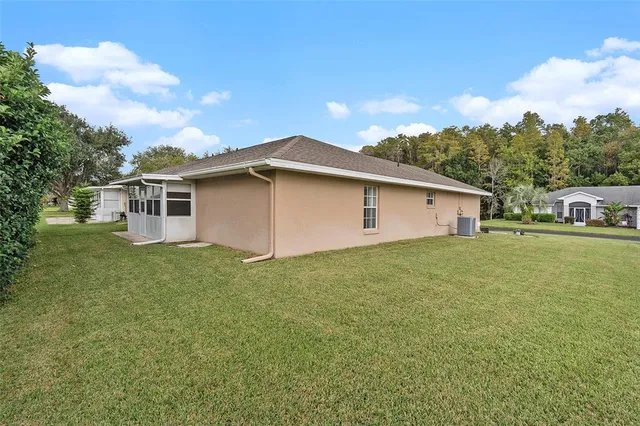 a very nice looking house with a big yard