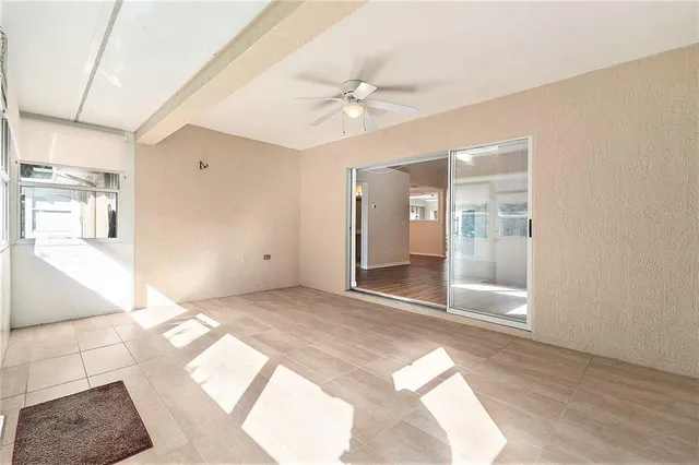 a view of a hallway with a window and a livingroom