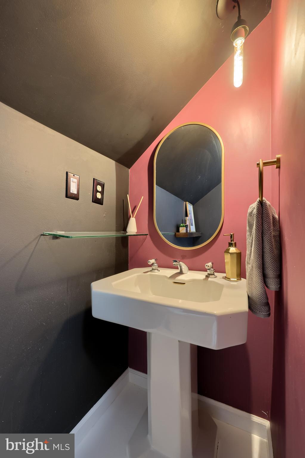 613 South Broad Street Lititz, PA 17543 - Photo 47 of 60 a bathroom with a sink a mirror and a toilet
