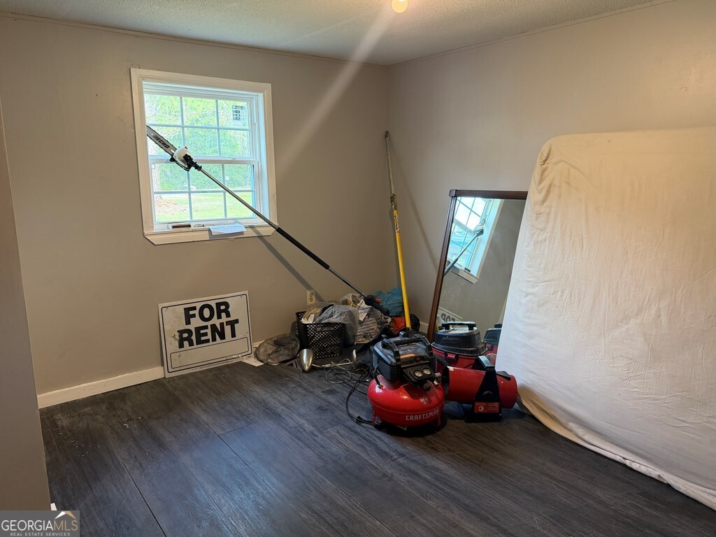 6022 Jenkins Road Albany, GA 31705 - Photo 9 of 24 a view of a room with wooden floor