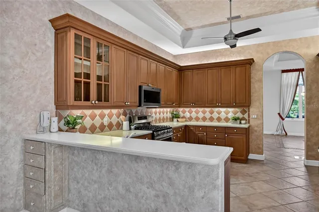 a living room with furniture a flat screen tv and a window