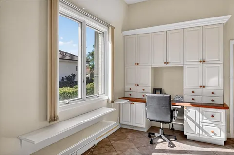 a bathroom with double vanity sinks a vanity two mirror and a shower