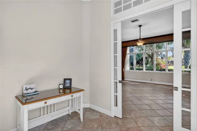 a bathroom with double vanity sinks a vanity two mirror and a shower