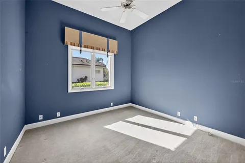 a bathroom with a granite countertop sink double vanity and a mirror