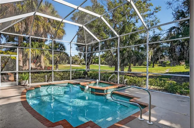 an aerial view of residential houses with outdoor space and river
