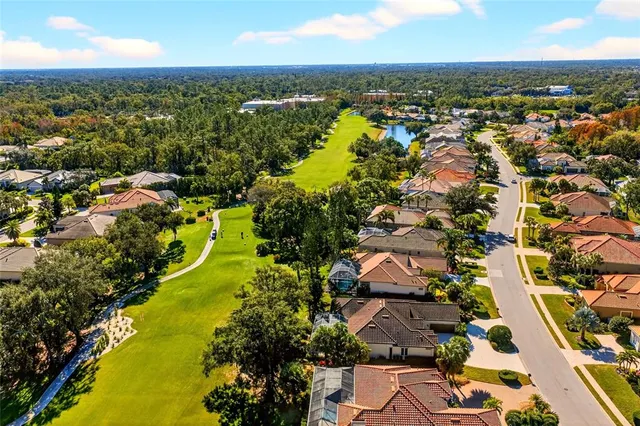 a view of a patio with a table and chairs under an umbrella