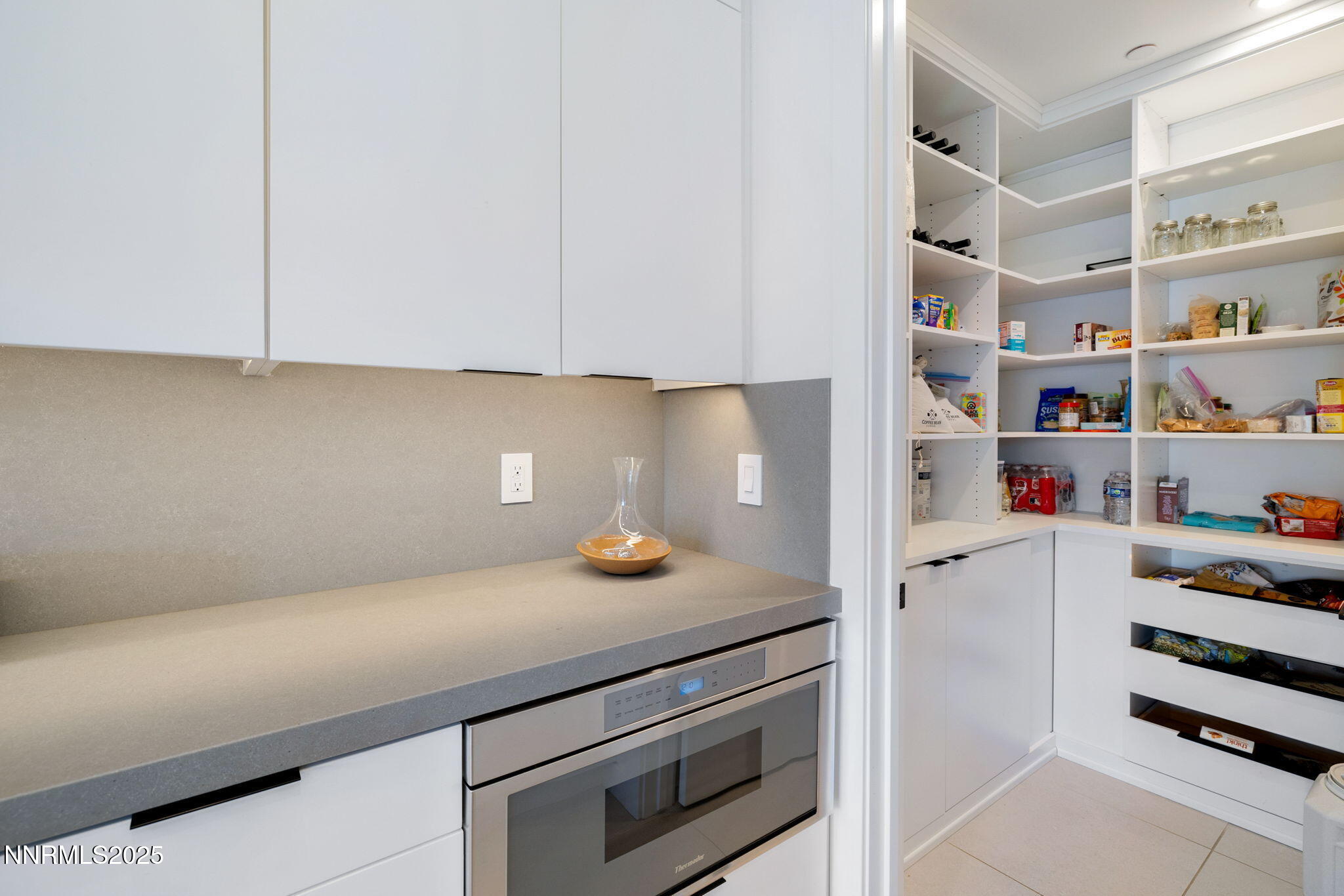 16 Persano Street Reno, NV 89511 - Photo 11 of 44 a kitchen with a cabinets and white appliances