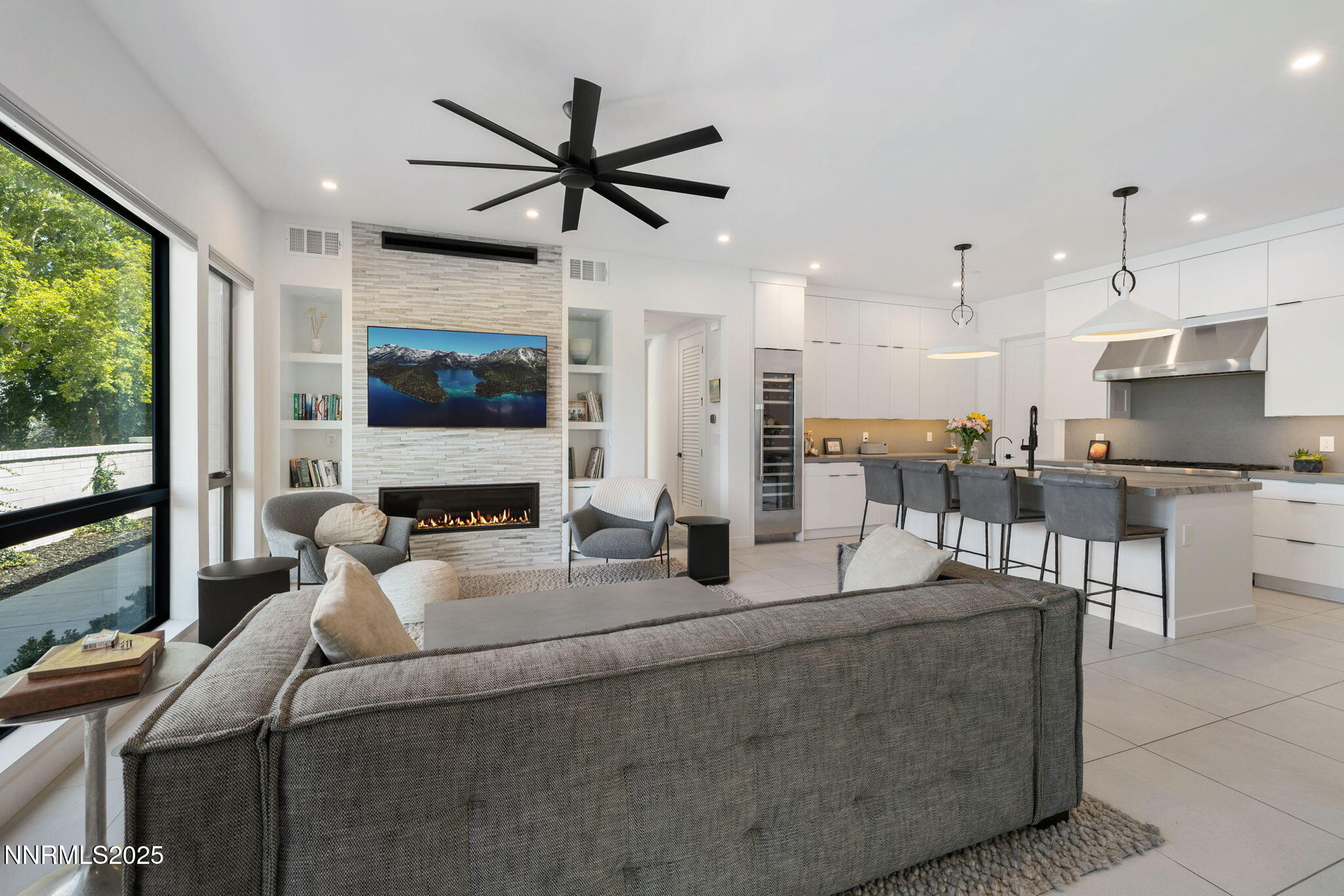 16 Persano Street Reno, NV 89511 - Photo 2 of 44 a living room with stainless steel appliances kitchen island granite countertop furniture and a fireplace
