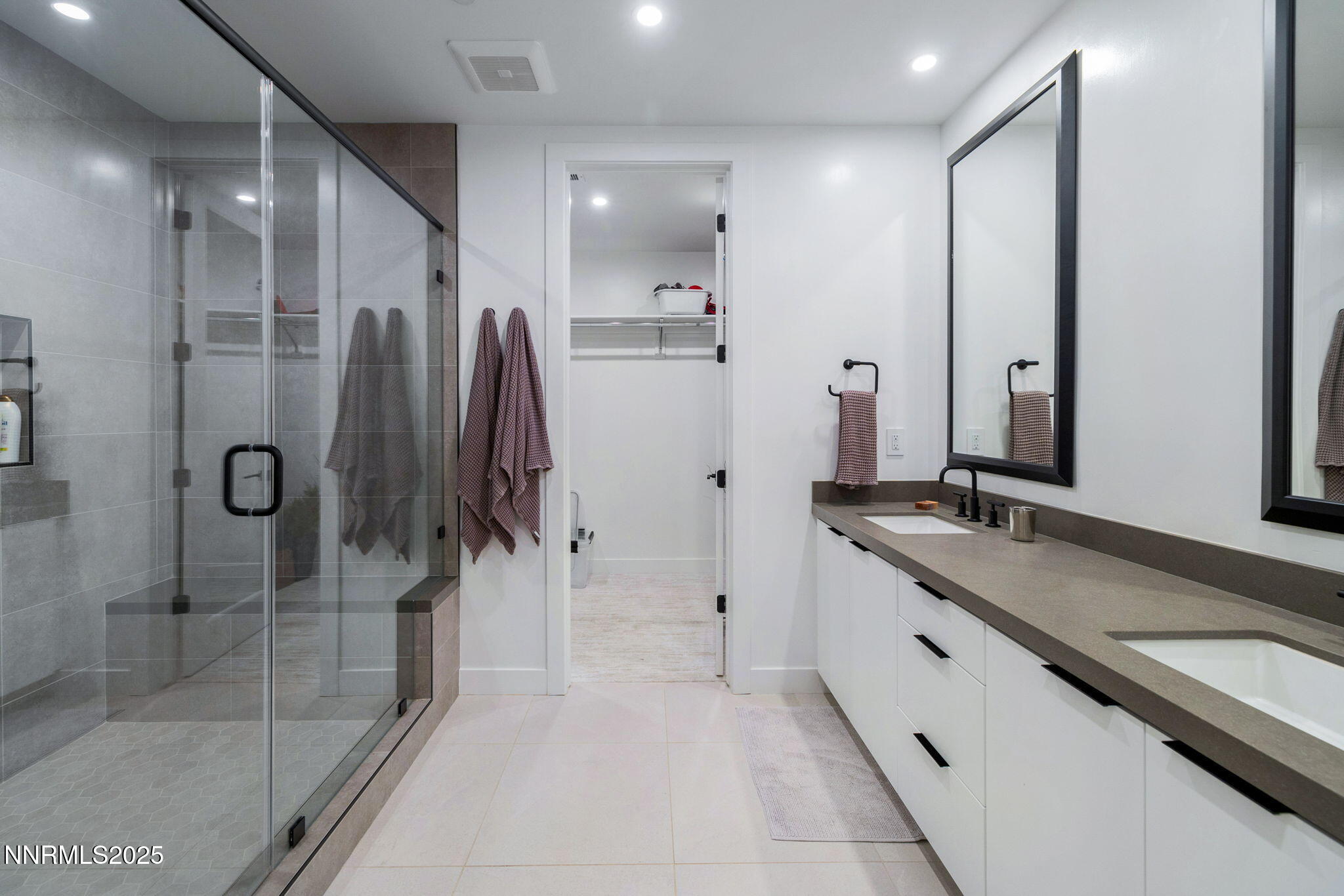 16 Persano Street Reno, NV 89511 - Photo 21 of 44 a bathroom with a double vanity sink and mirror