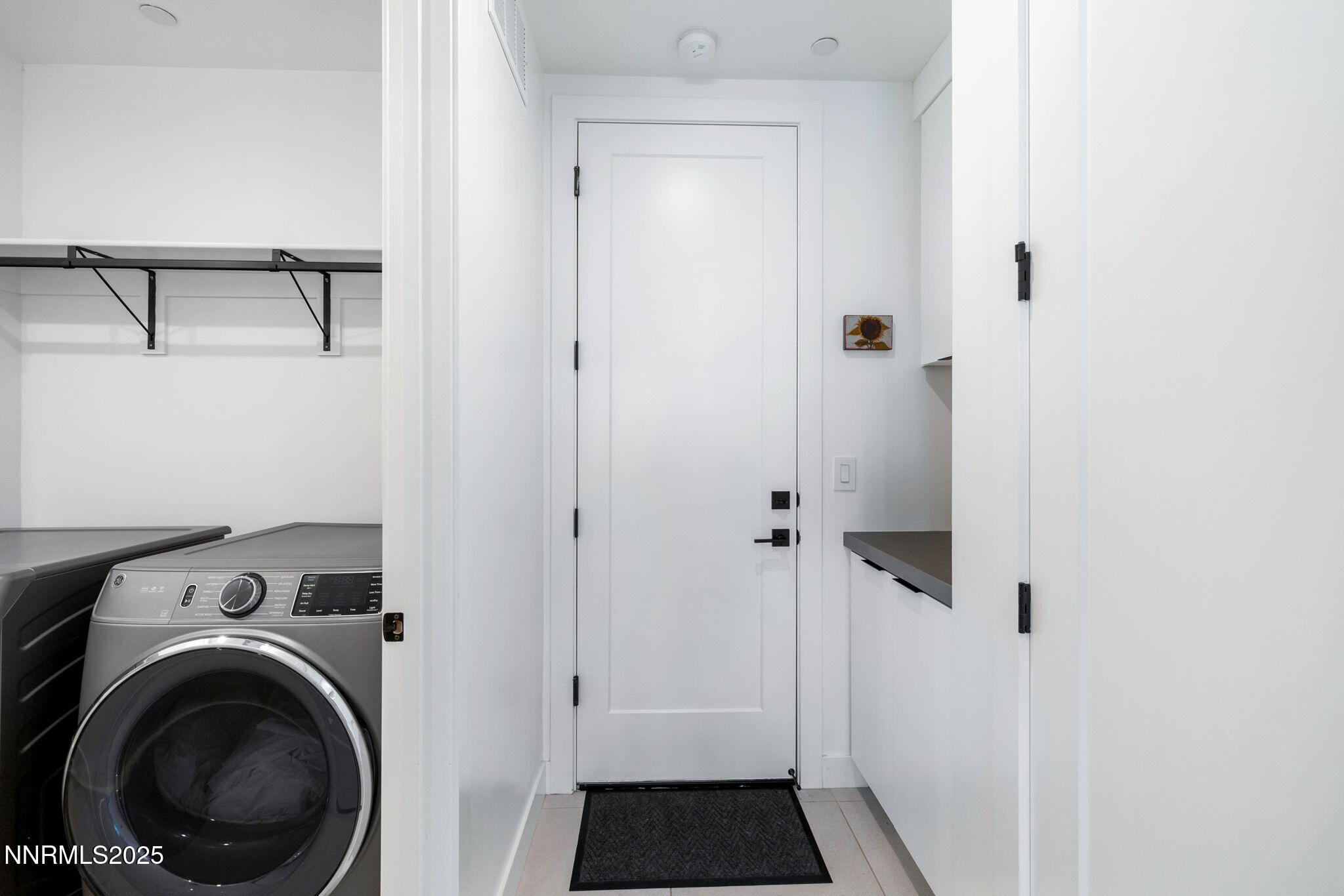 16 Persano Street Reno, NV 89511 - Photo 25 of 44 a view of a hallway with washer and dryer