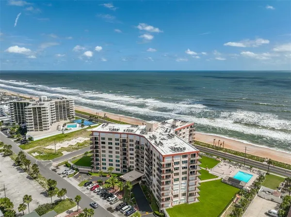 a view of a balcony with an ocean view