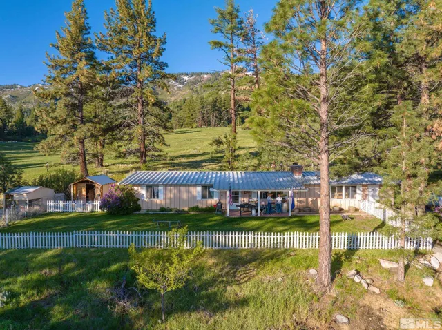 a view of swimming pool with outdoor seating and garden