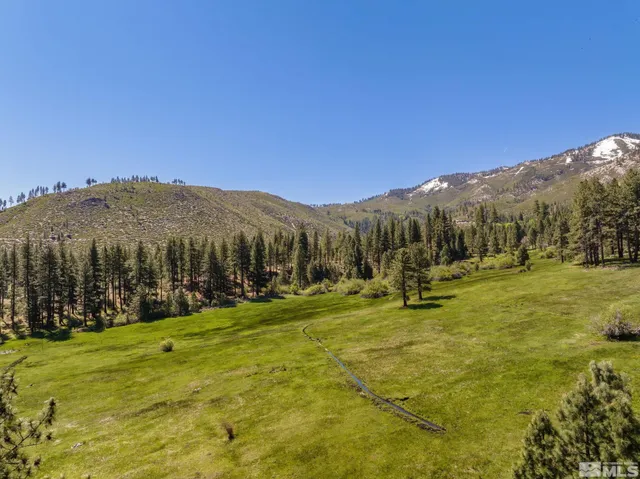 a view of a town with mountains in the background