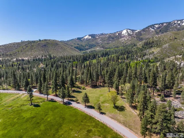 a view of a town with mountains in the background