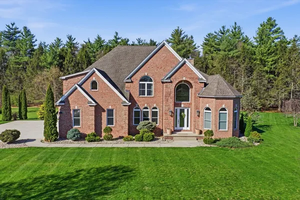 a front view of a house with a yard