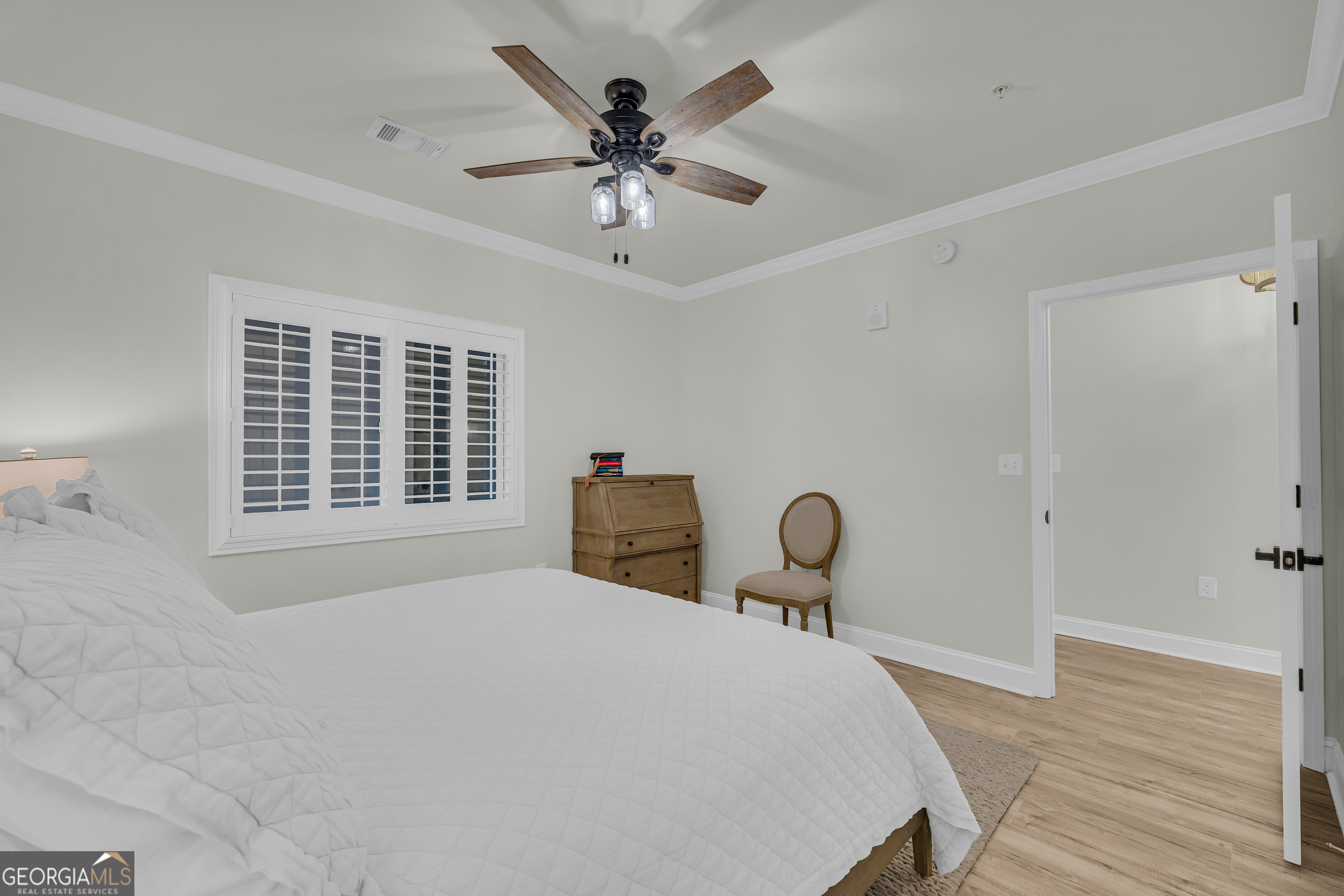 755 East Broad Street, Unit 803 Athens, GA 30601 - Photo 21 of 57 a bedroom with a bed and a chandelier