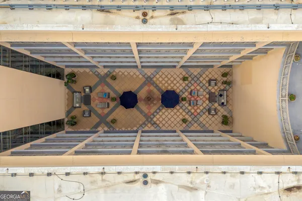 an aerial view of a swimming pool with a balcony