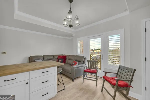 a kitchen with stainless steel appliances kitchen island granite countertop a refrigerator and a sink