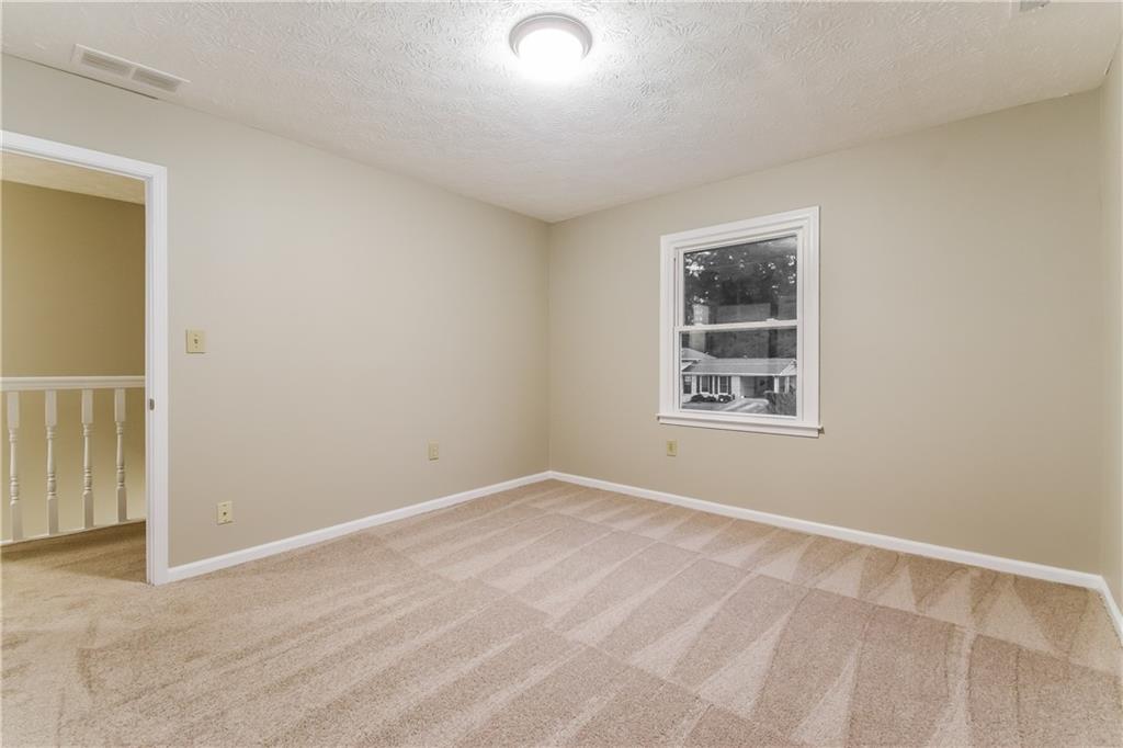 3119 Windfield Circle Tucker, GA 30084 - Photo 16 of 20 a view of an empty room with a window
