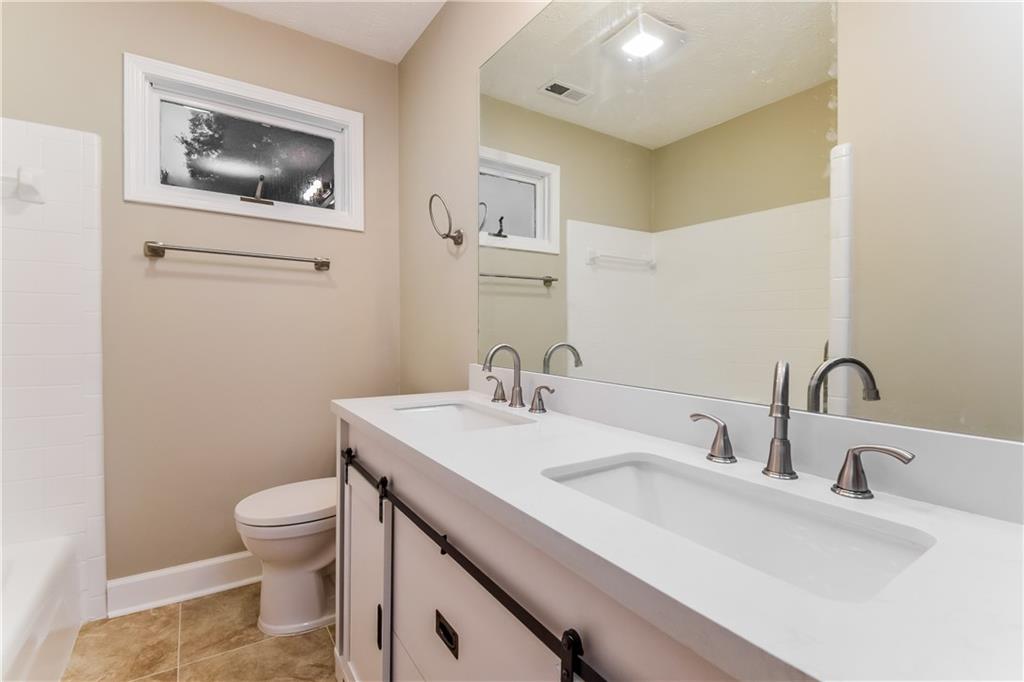 3119 Windfield Circle Tucker, GA 30084 - Photo 17 of 20 a bathroom with a sink and a toilet