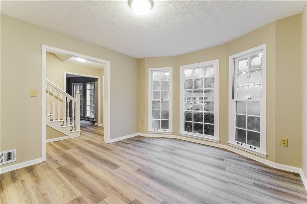 3119 Windfield Circle Tucker, GA 30084 - Photo 7 of 20 a view of a livingroom with wooden floor and a window