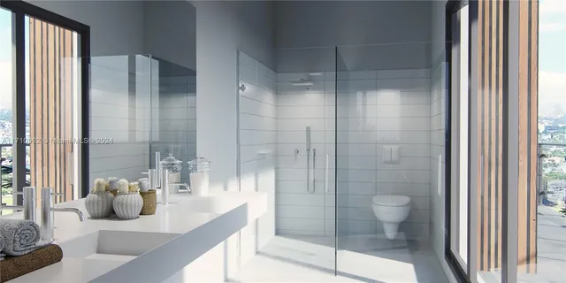 a bathroom with a shower and a sink