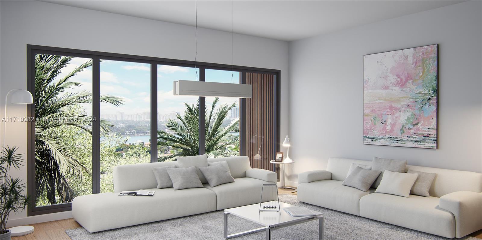 2005 Calais Drive, Unit 1 Miami Beach, FL 33141 - Photo 5 of 9 a living room with furniture and a large window