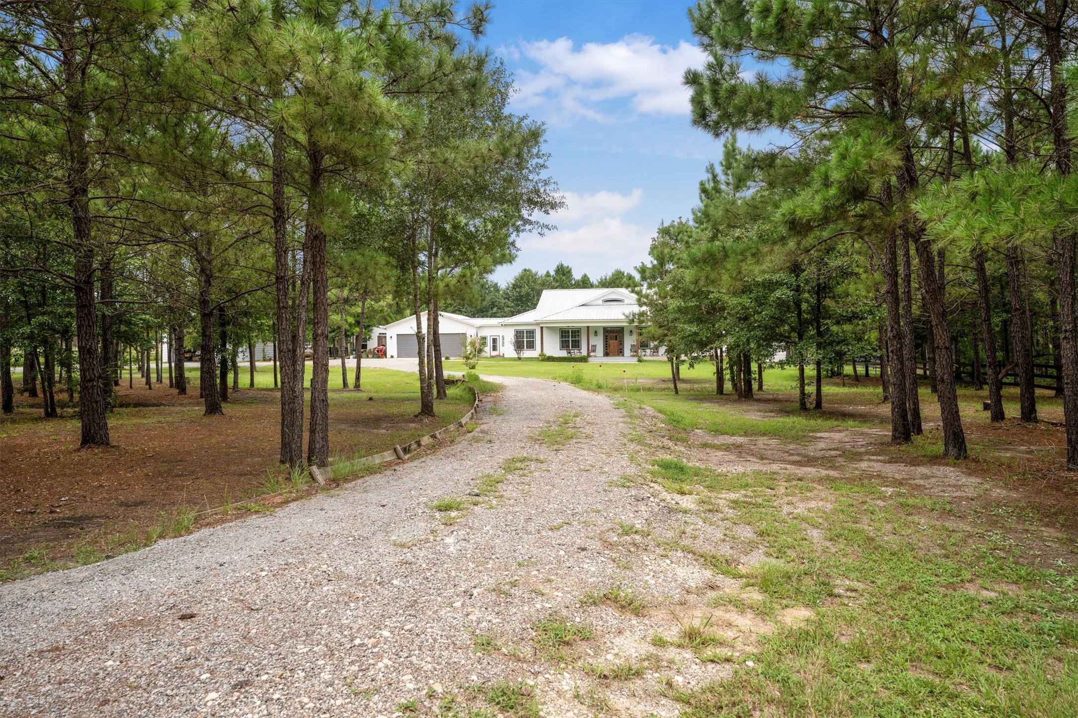 1022 Fm 1696 Road West Huntsville, TX 77320 - Photo 2 of 50 The long circular drive surrounded by beautiful trees provide privacy, scenery and tranquility
