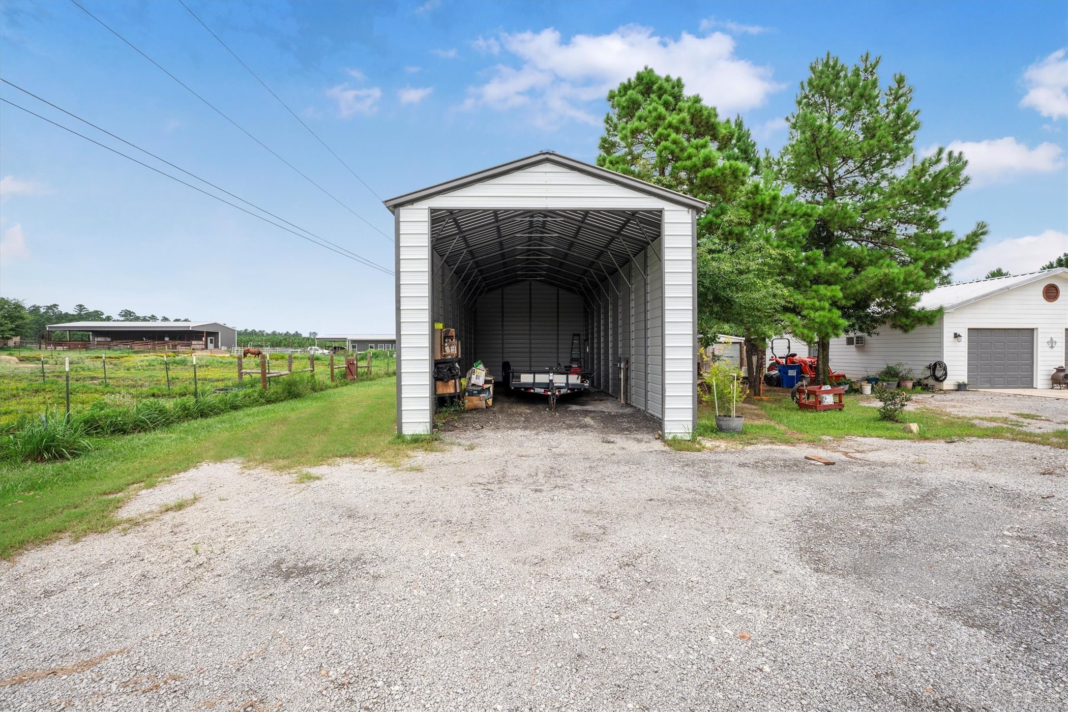 1022 Fm 1696 Road West Huntsville, TX 77320 - Photo 31 of 50 The covered RV storage has electric and water hookups