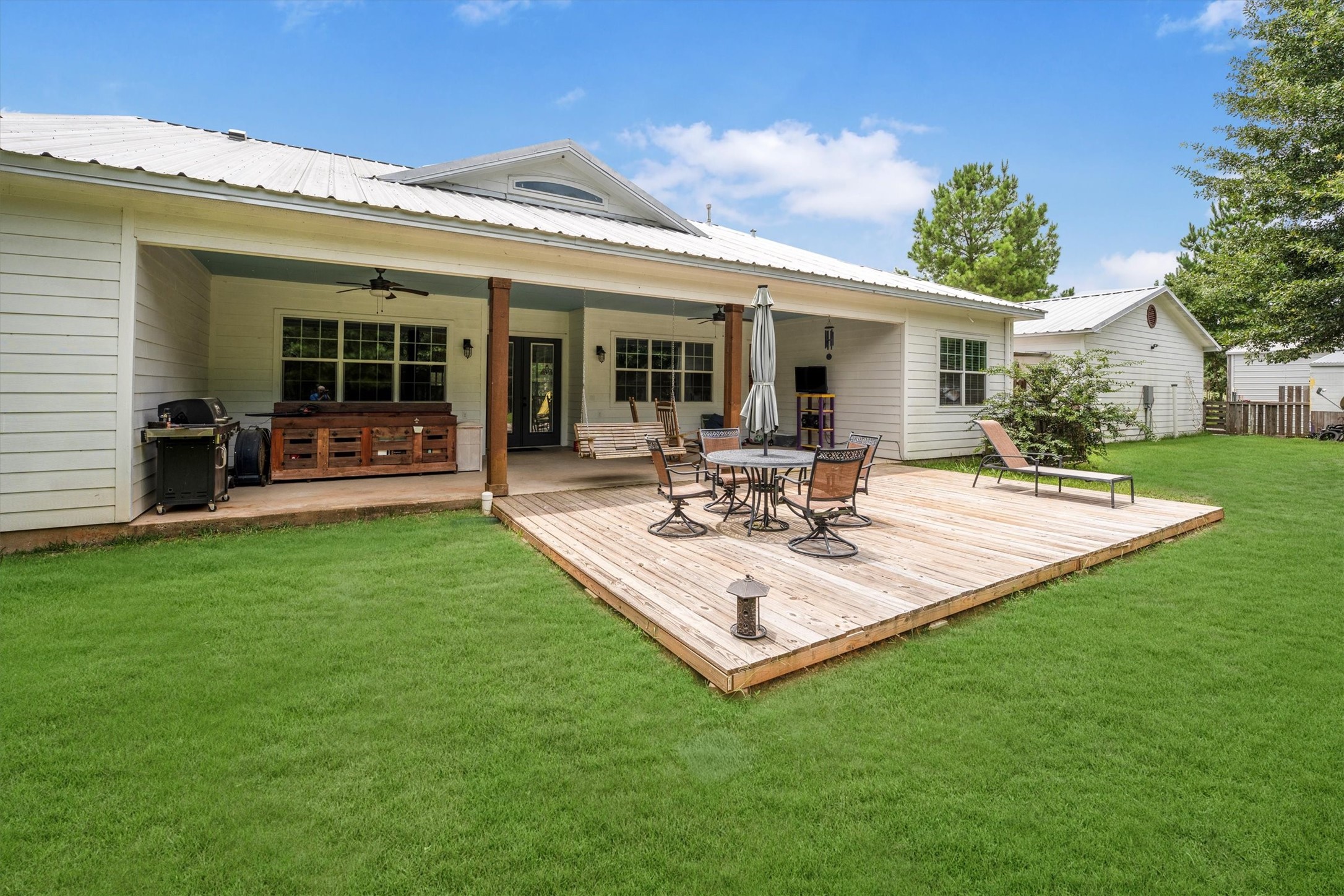 1022 Fm 1696 Road West Huntsville, TX 77320 - Photo 42 of 50 A spacious deck extends off of the covered patio space