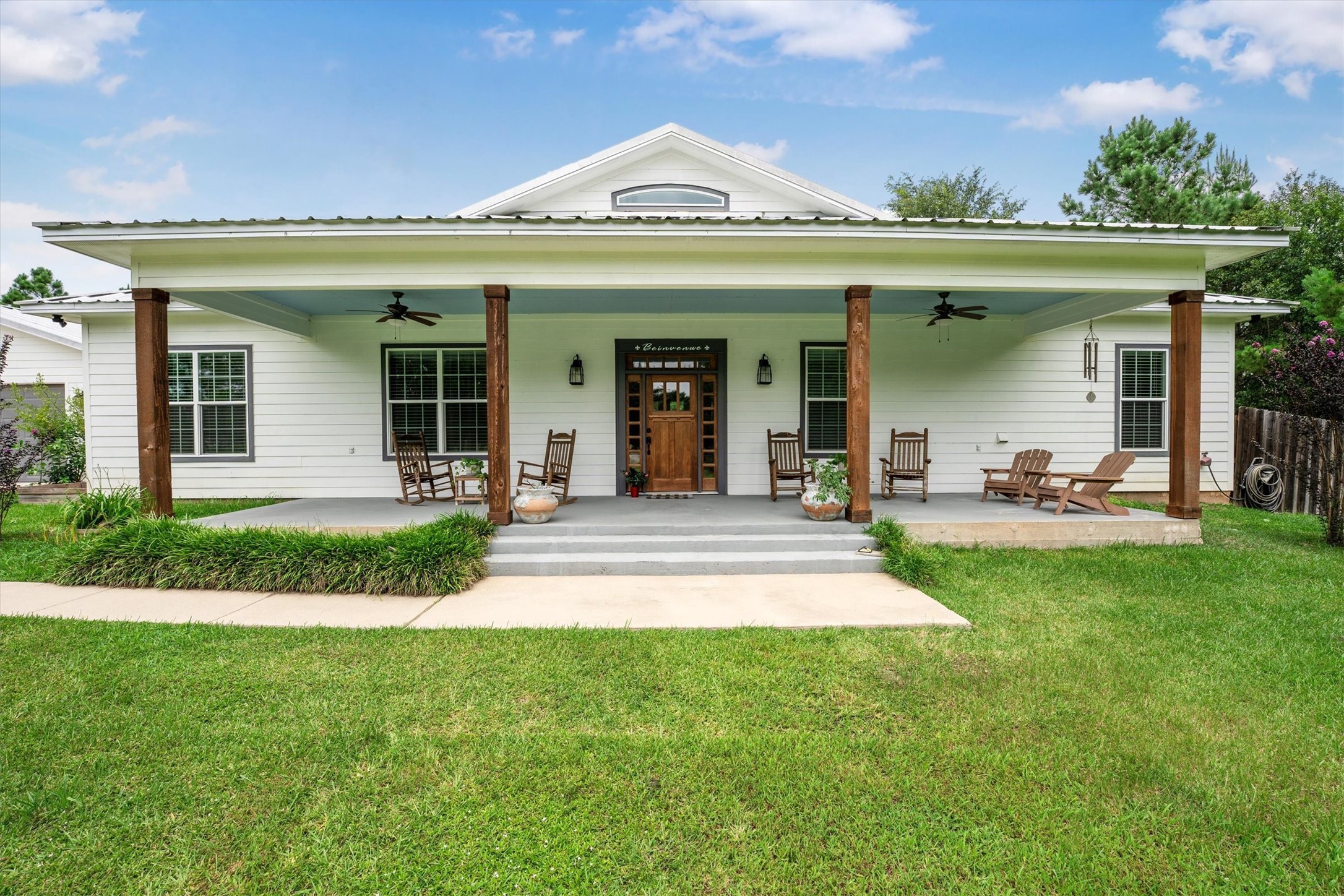 1022 Fm 1696 Road West Huntsville, TX 77320 - Photo 5 of 50 Expansive front porch with ceiling fans perfect for enjoying the natural beauty of the land