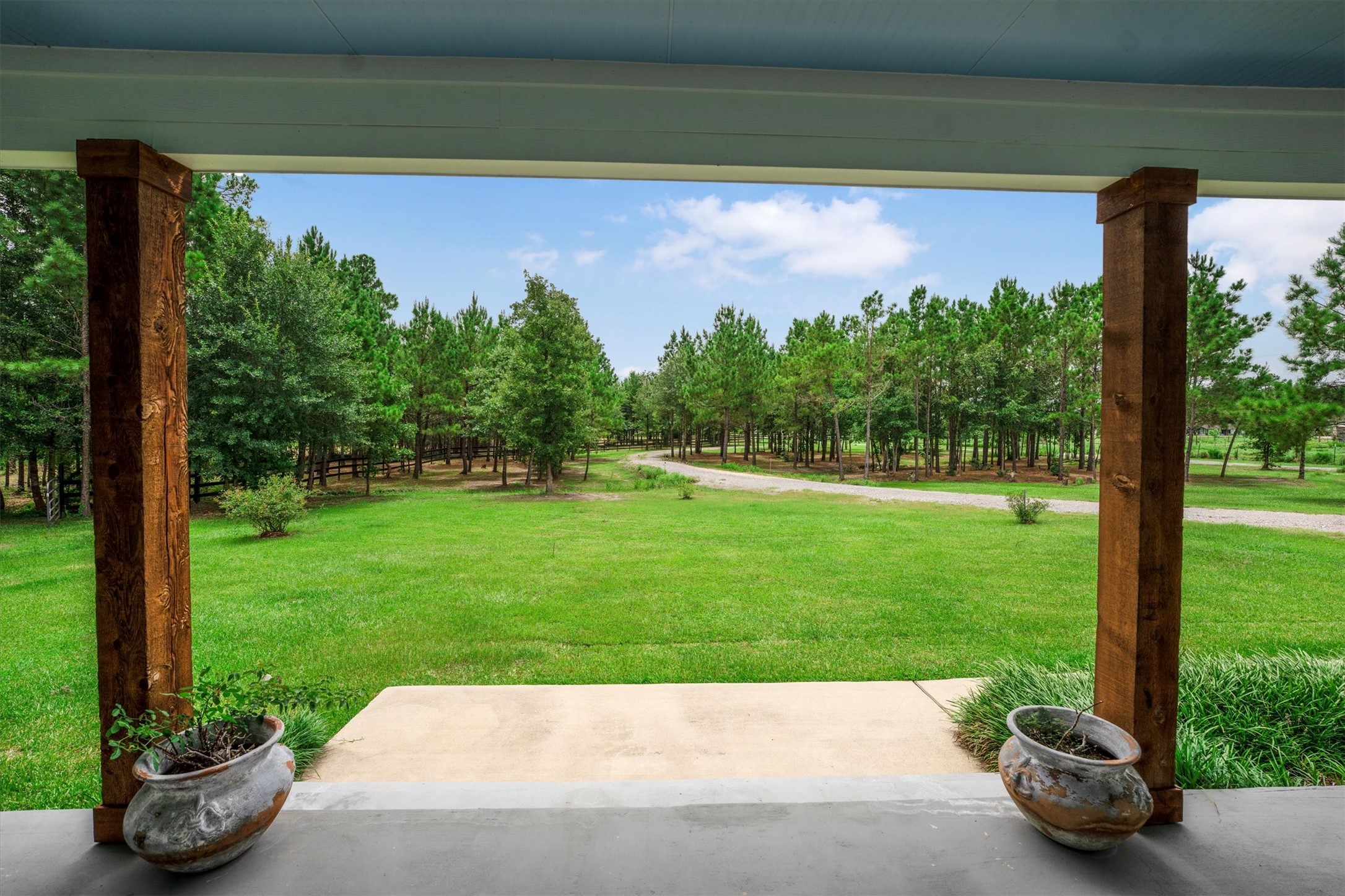 1022 Fm 1696 Road West Huntsville, TX 77320 - Photo 7 of 50 A nice sized front land, circle driveway and trees providing privacy from the road