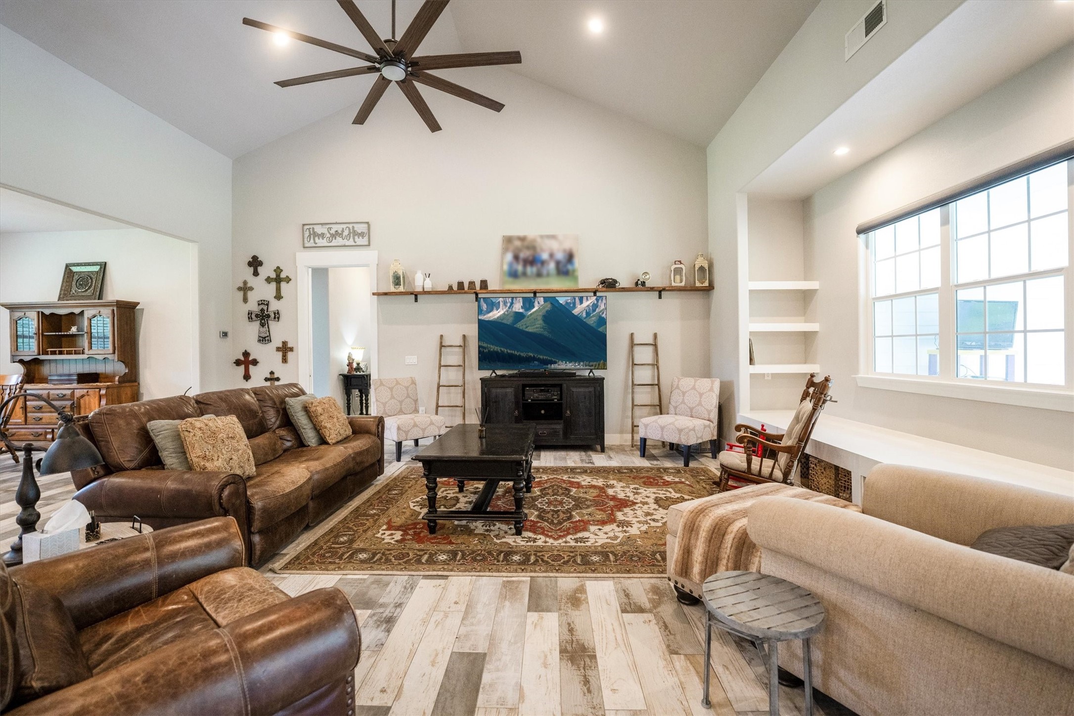 1022 Fm 1696 Road West Huntsville, TX 77320 - Photo 10 of 50 A large window with window seat creates a cozy additional seating area with built in shelving