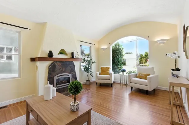 a living room with furniture and a fireplace