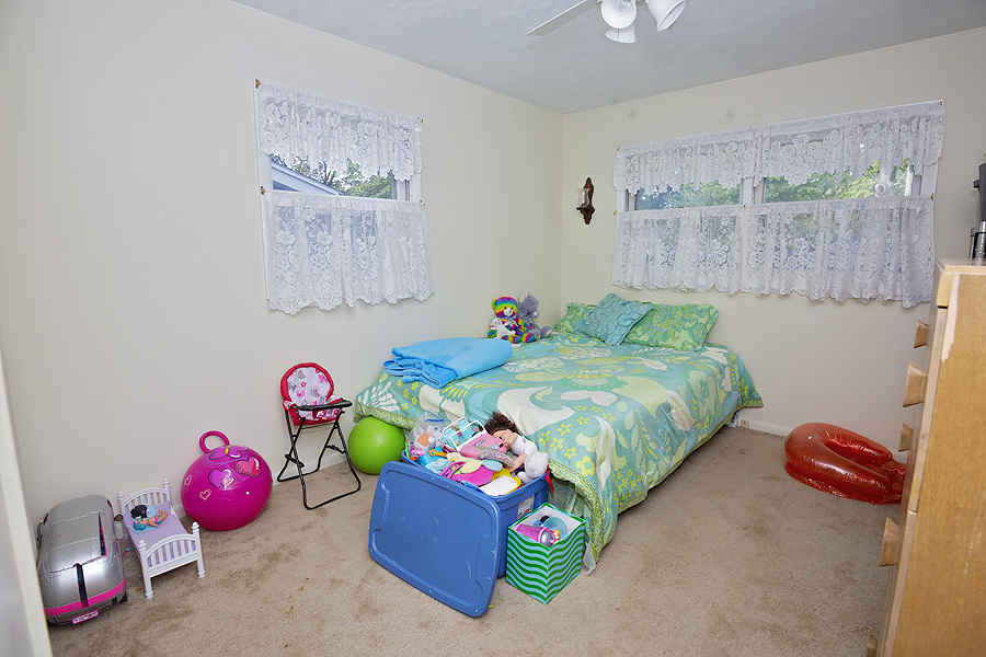 1313 Rutledge Road Bloomington, IL 61704 - Photo 12 of 29 a bedroom with bed and a painting on the wall