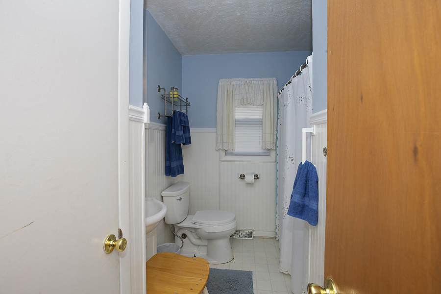 1313 Rutledge Road Bloomington, IL 61704 - Photo 14 of 29 a bathroom with a toilet and a shower
