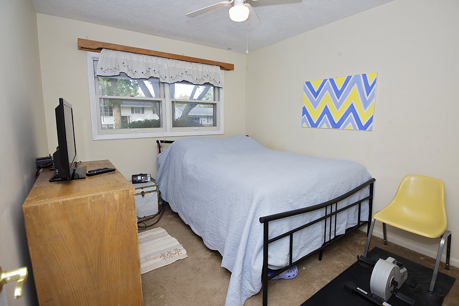 1313 Rutledge Road Bloomington, IL 61704 - Photo 15 of 29 a bed room with a bed and a window