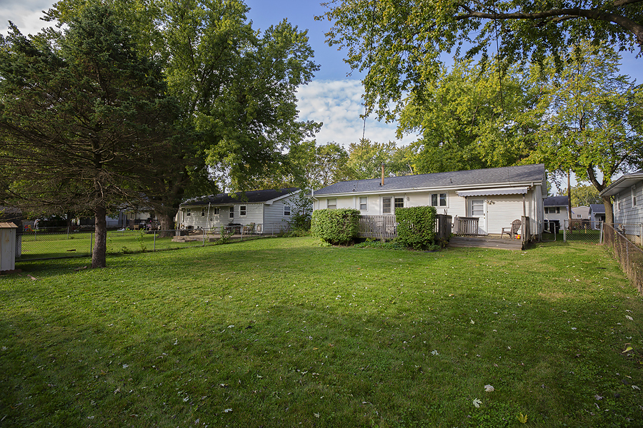 1313 Rutledge Road Bloomington, IL 61704 - Photo 2 of 29 a front view of a house with a yard and trees