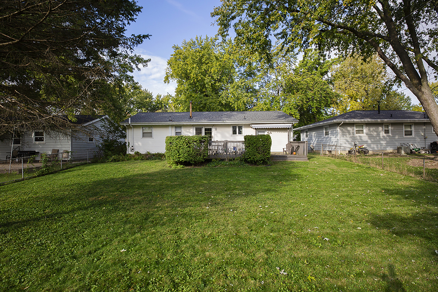 1313 Rutledge Road Bloomington, IL 61704 - Photo 21 of 29 a view of a house with a yard deck and a tree