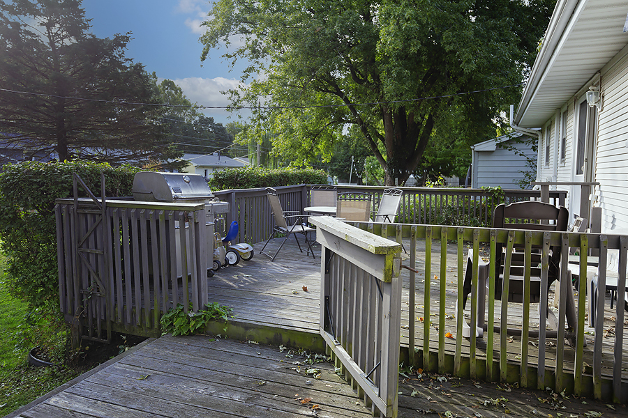 1313 Rutledge Road Bloomington, IL 61704 - Photo 23 of 29 a balcony with wooden floor and yard in the back