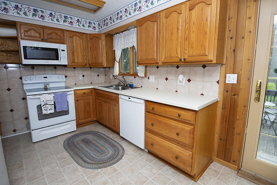 1313 Rutledge Road Bloomington, IL 61704 - Photo 6 of 29 a kitchen with stainless steel appliances granite countertop a sink stove and cabinets